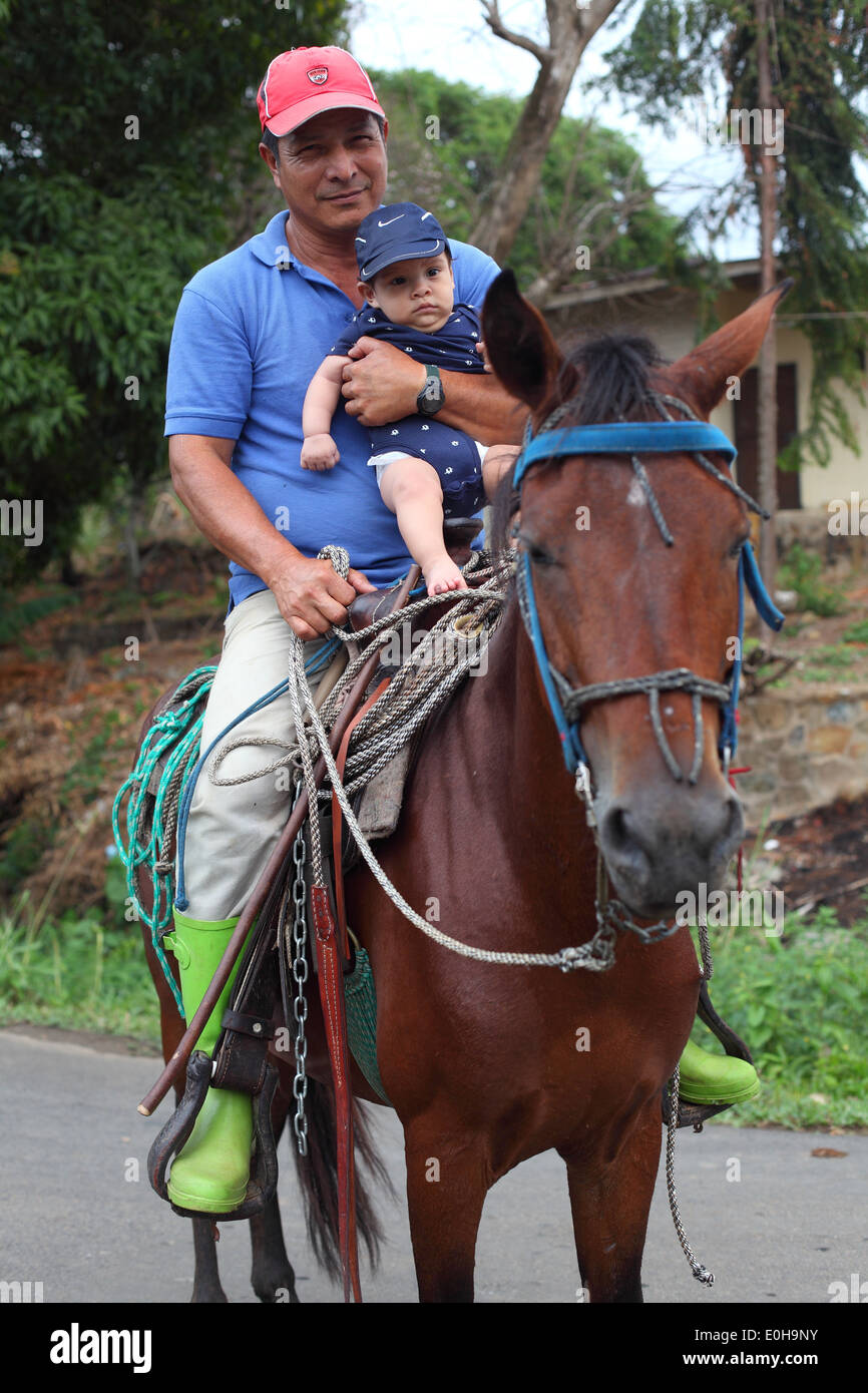 baby riding horse