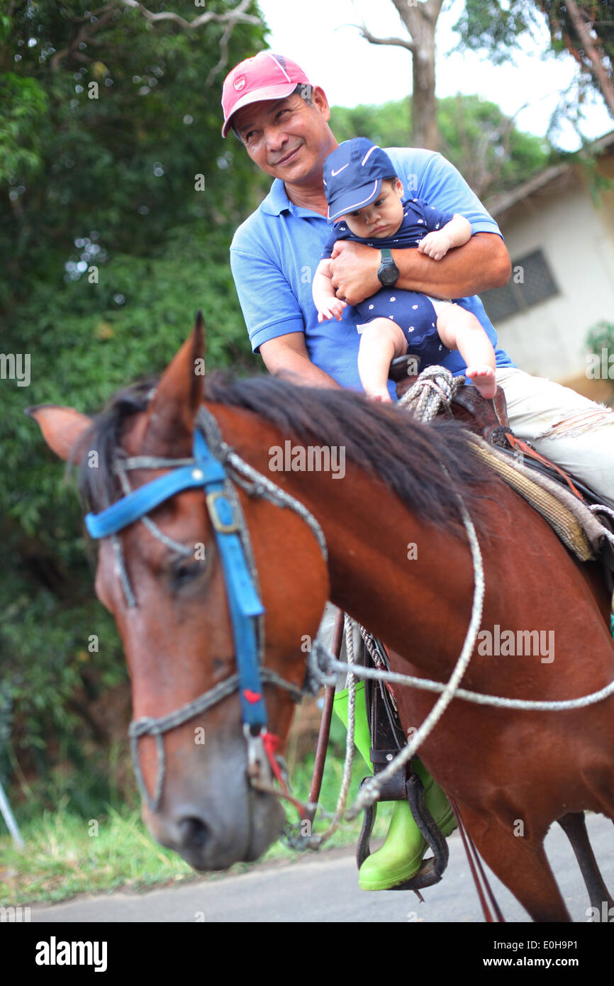 baby riding horse