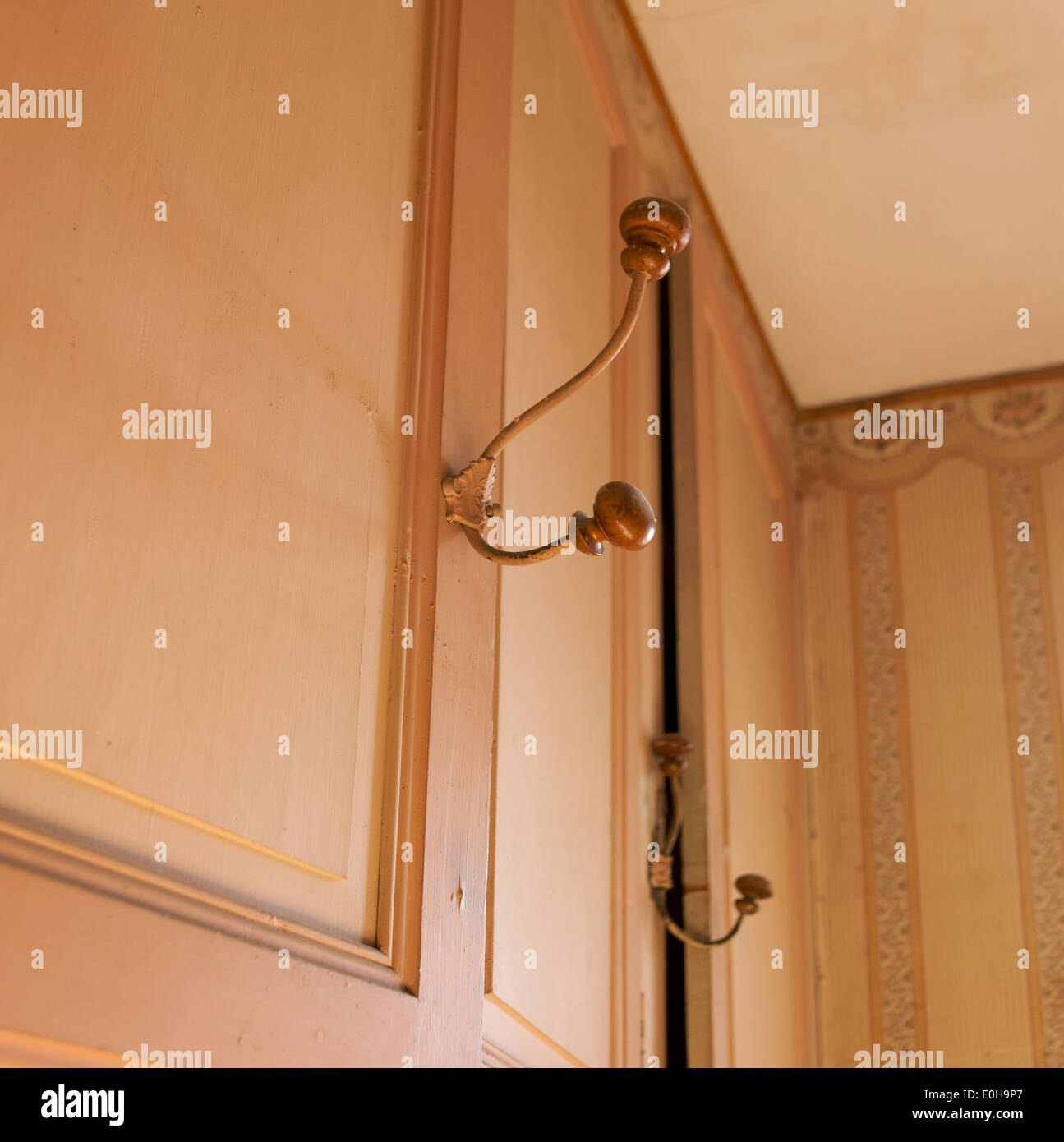 Old coat hangers on the wall of an old house Stock Photo Alamy