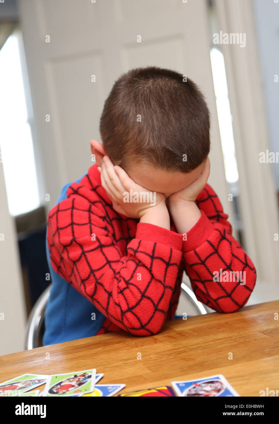 4 year old boy sulking Stock Photo