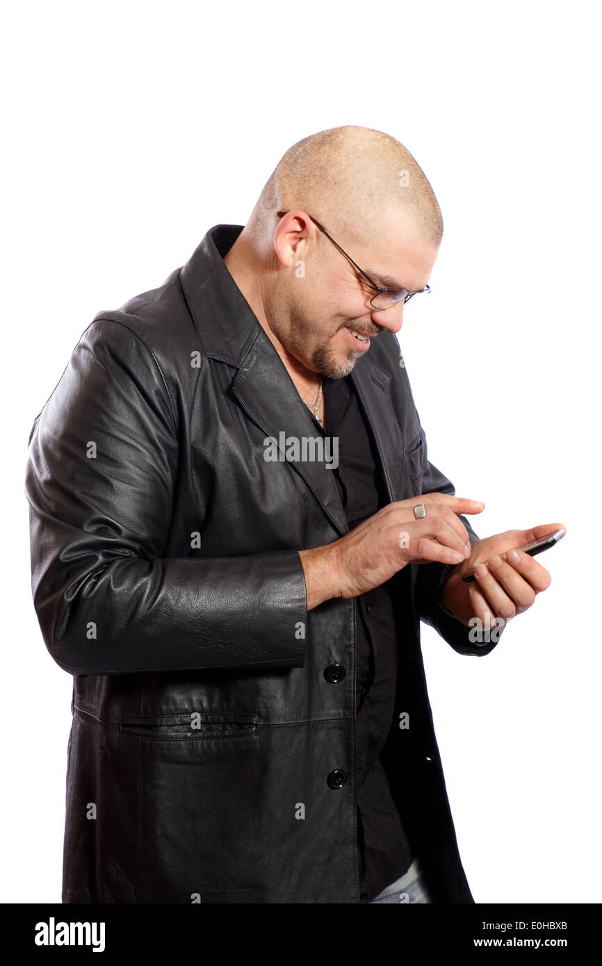 Man uses his touch screen mobile phone Stock Photo