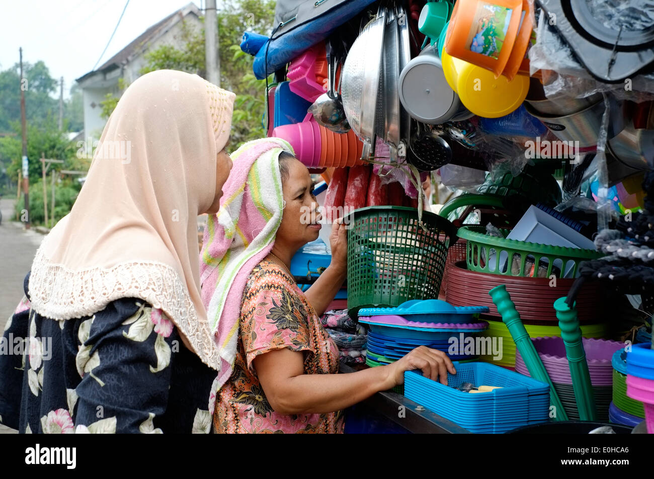 locals in a rural village in east java indonesia gather around a truck ...
