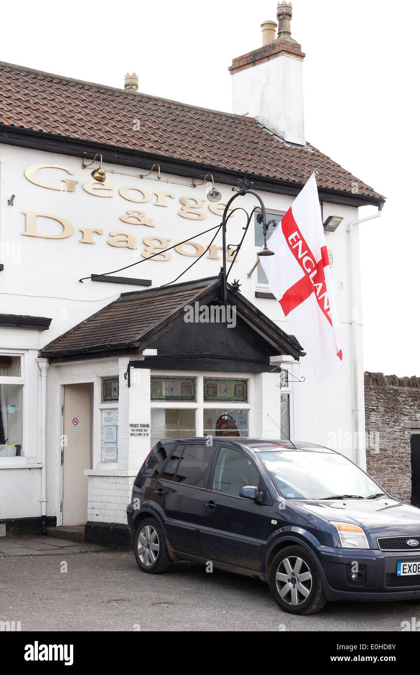 The George & Dragon pub in Winterbourne flying the flag of England on St Georges day 23 April 2014 Stock Photo