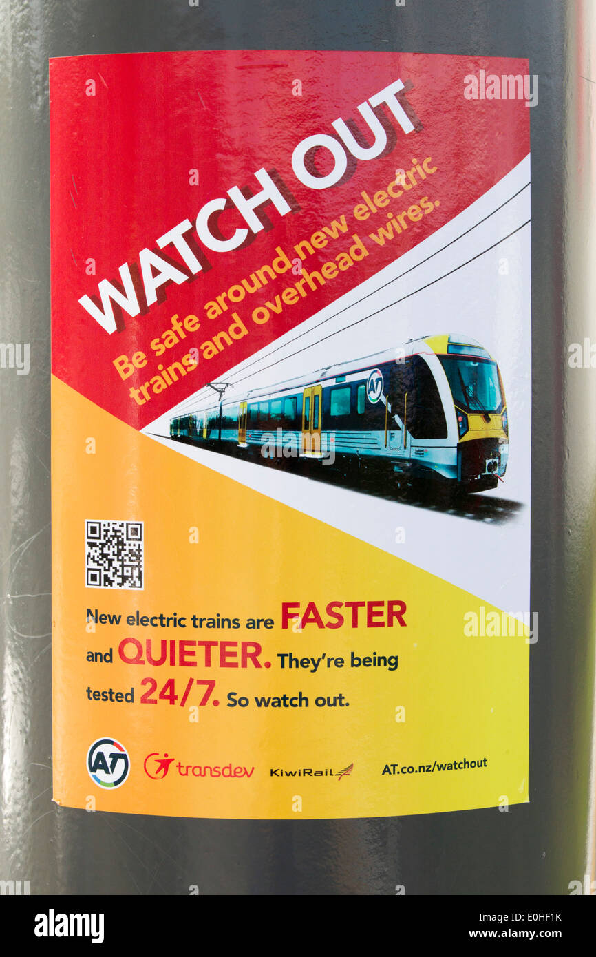 Warning Sign for the new Auckland Transport Electric Train on its first day of operation, Onehunga, Auckland, New Zealand, Stock Photo