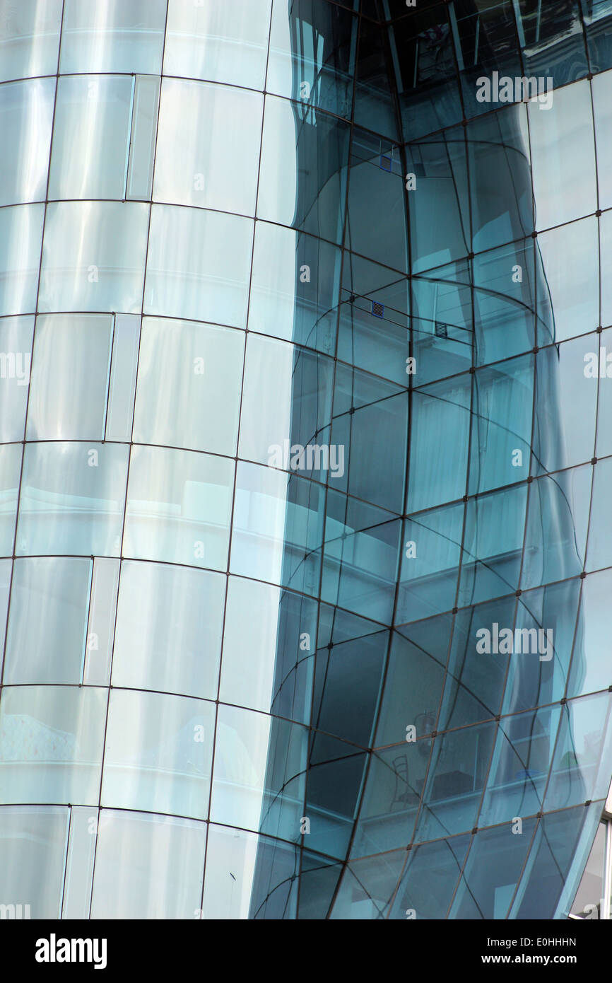 Abstract reflections in  the curved windows of a building in Quito, Ecuador Stock Photo