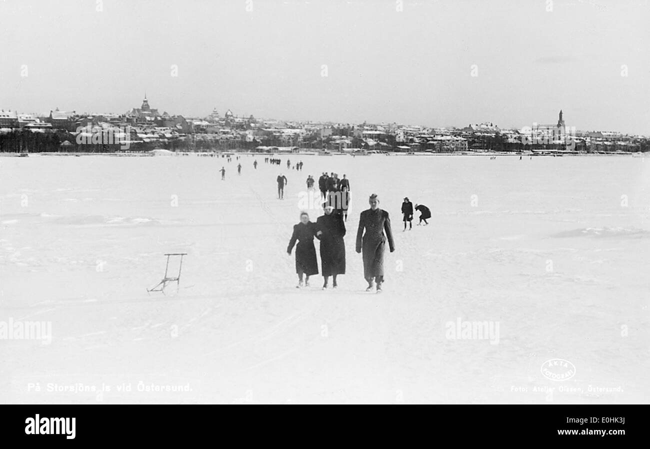 A photograph of individuals on the ice of Lake Storsjön in Östersund ...
