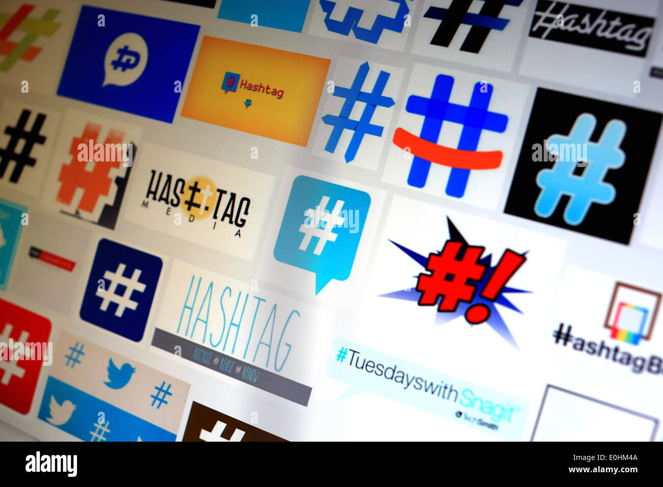 A computer screen on hashtag signs used in social media like Twitter and Facebook on the internet Stock Photo
