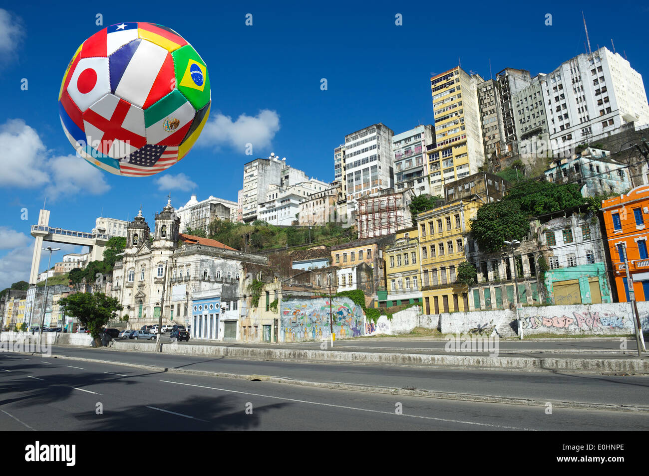 International football soccer ball flying in the sky above Salvador Bahia Brazil city skyline Stock Photo