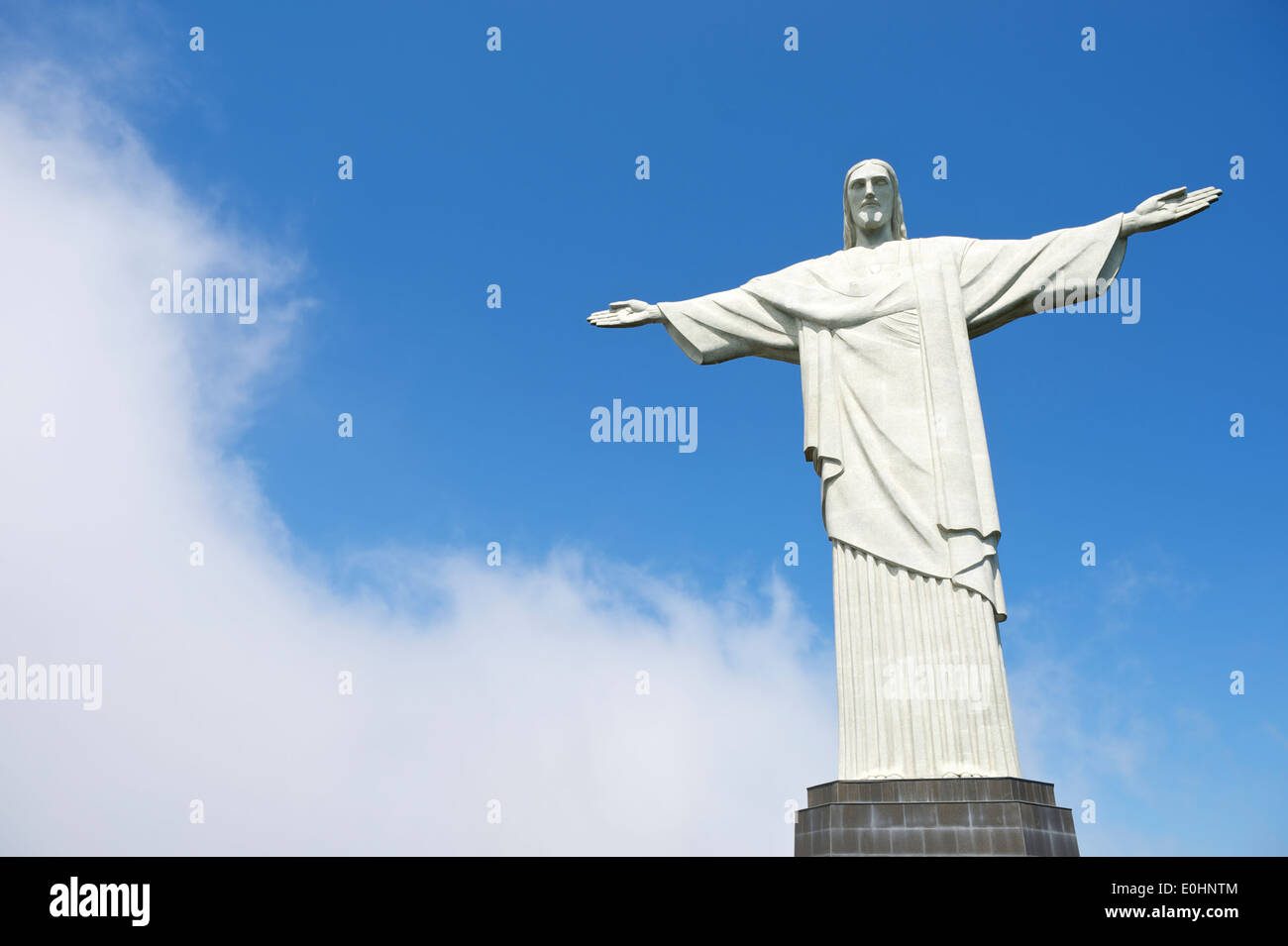 Corcovado weather Christ the Redeemer stands next to swirling mist clouds in Rio de Janeiro Brazil Stock Photo
