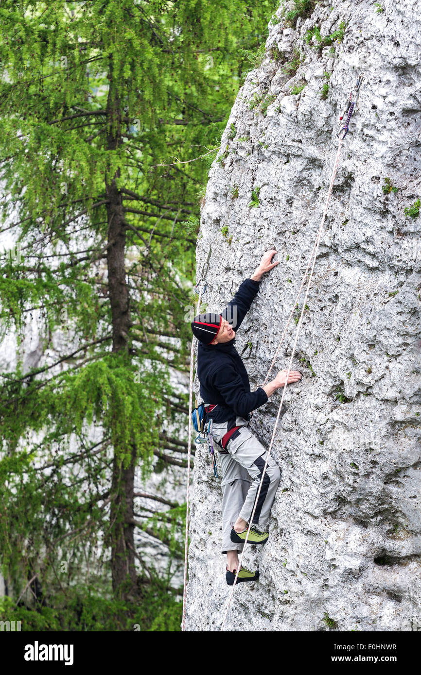 Rock climber in natural environment. Stock Photo