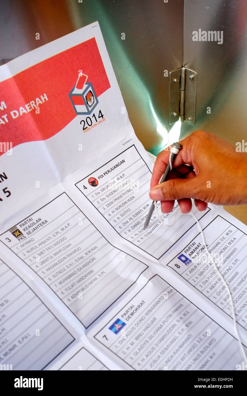 Local Woman Casts Her Vote During Indonesian Political Elections Stock