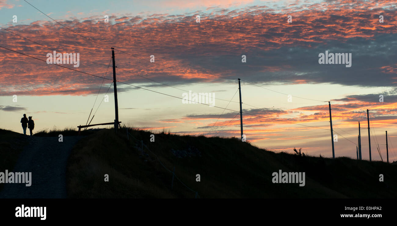 Silhouette of two people at sunset, Ferryland, Calvert, Avalon ...