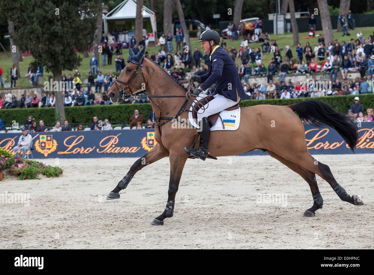Ulrich Kirchhoff riding in the Furusiyya FEI Nations Cup show jumping competition at Piazza di Siena in Rome's Villa Borghese. Stock Photo