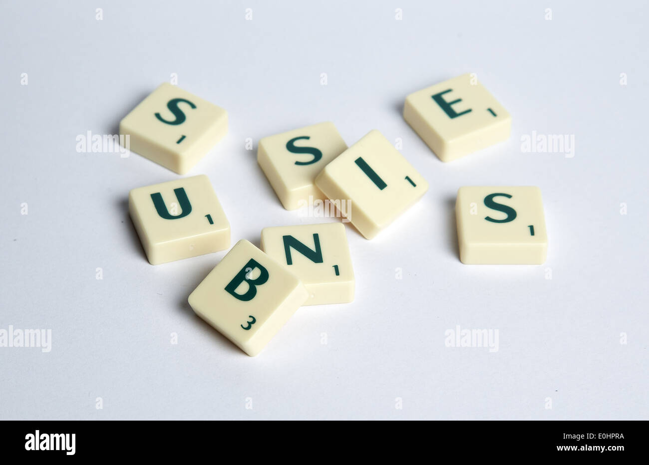 a jumbled collection of scrabble letters making up the word business Stock Photo