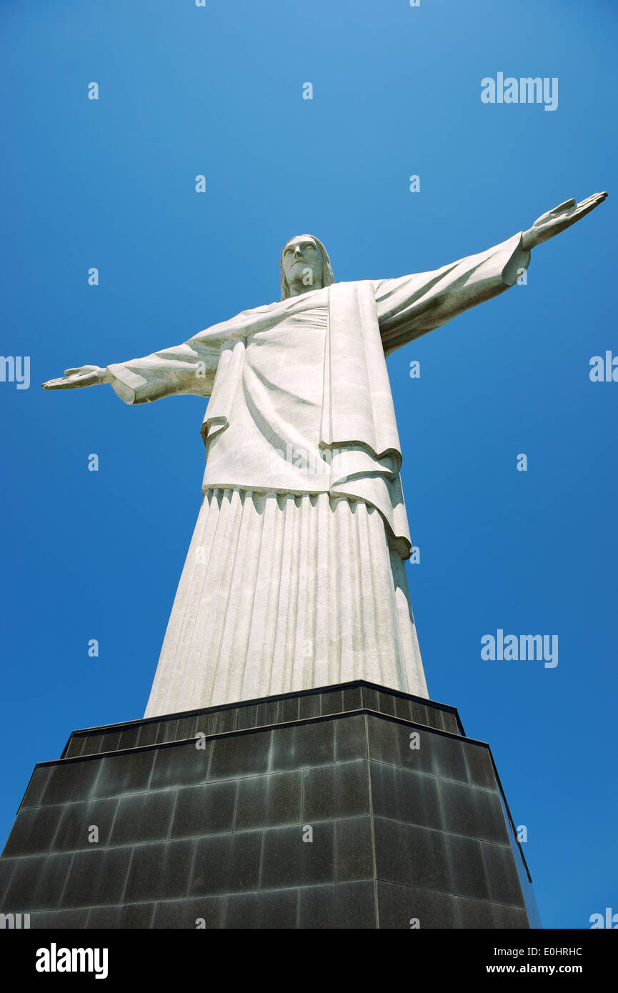 Corcovado Christ the Redeemer standing on base in blue sky in Rio de Janeiro Brazil Stock Photo