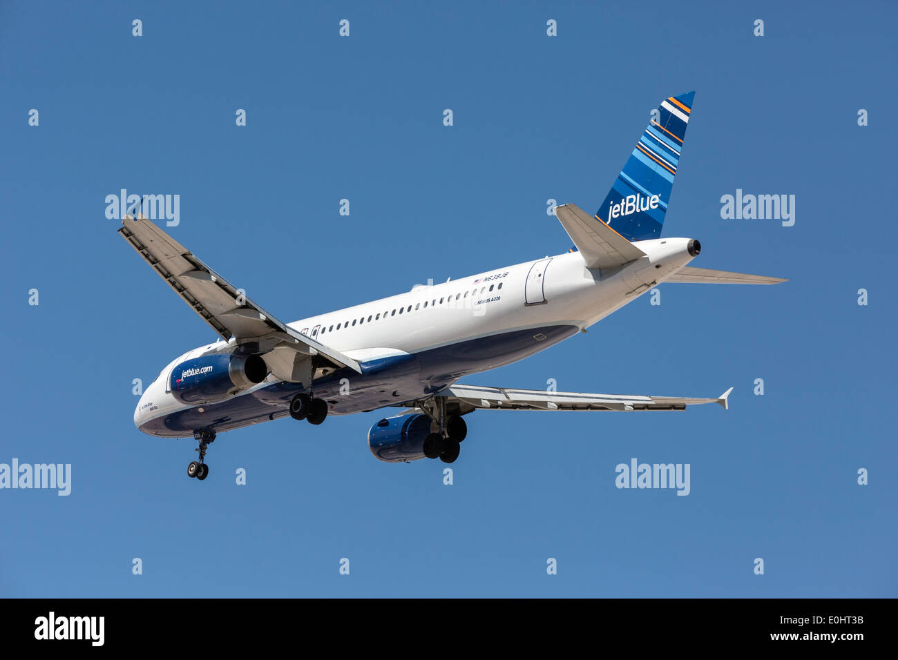 An Airbus A320 of JetBlue on final approach Stock Photo
