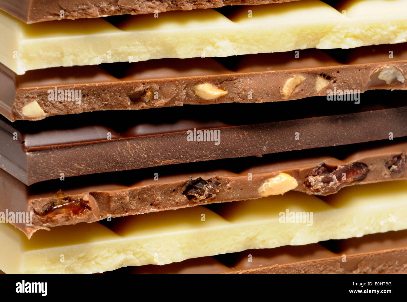 Chocolate - white, milk, dark, fruit and nut and hazelnut bars in a stack Stock Photo