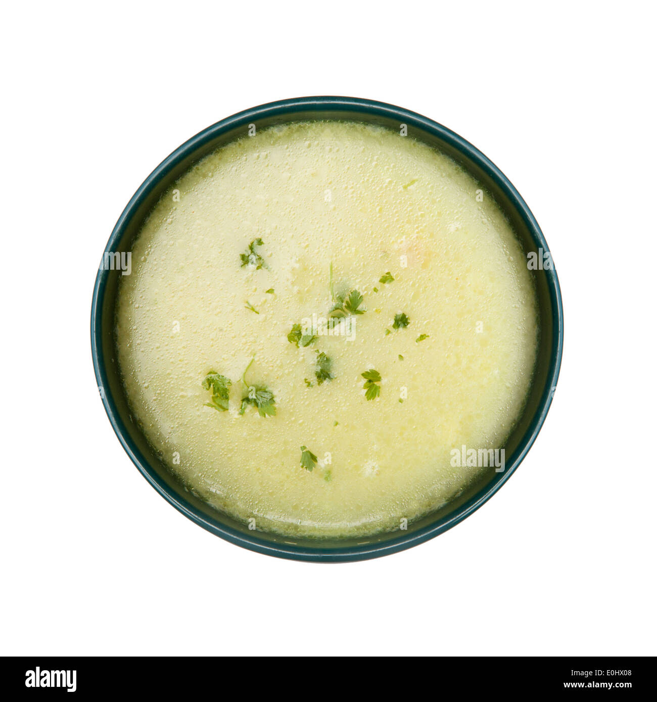 Potato and green vegetables soup, isolated on white background Stock Photo