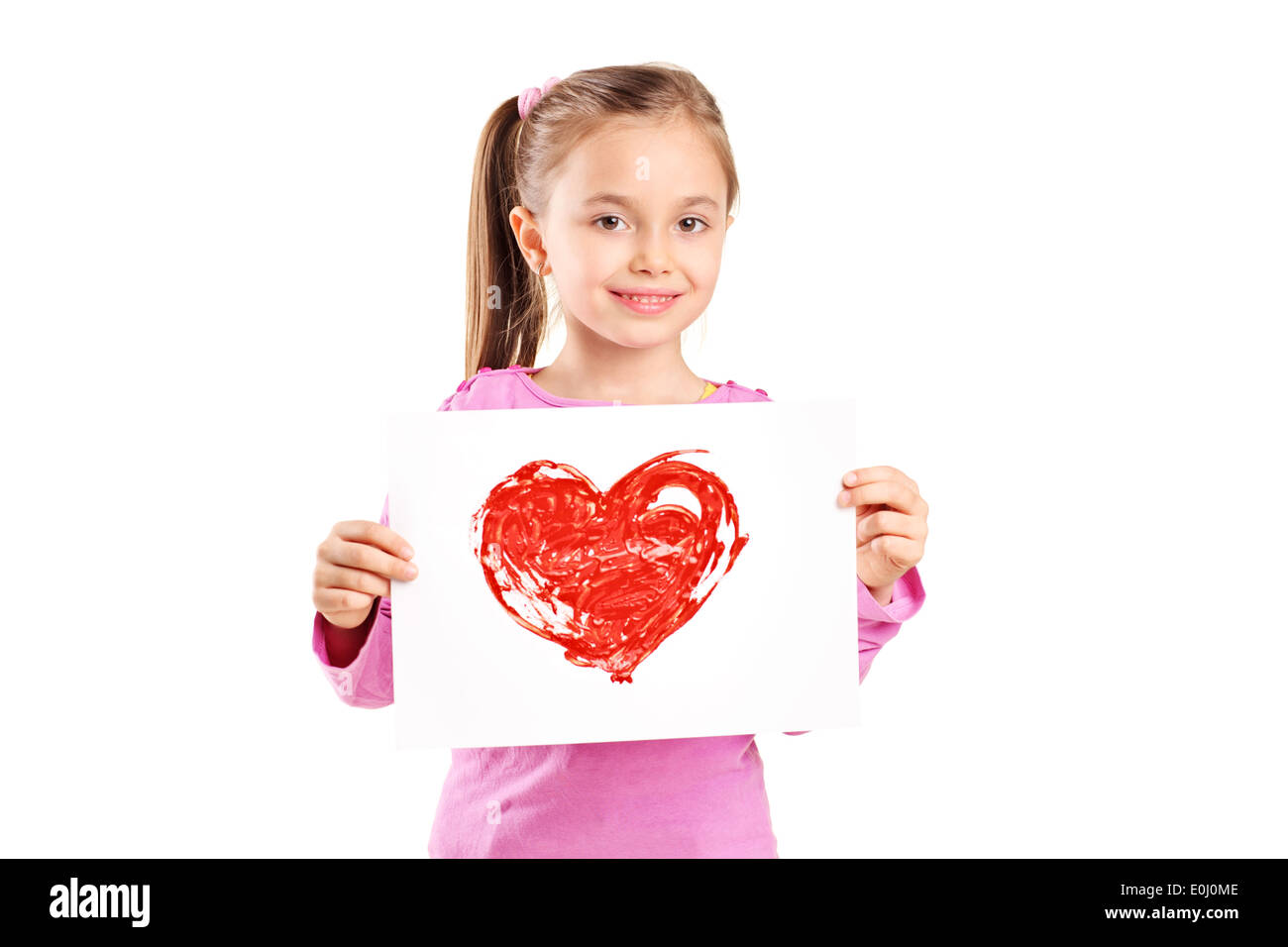 Cute little girl holding a painting of a red heart Stock Photo - Alamy