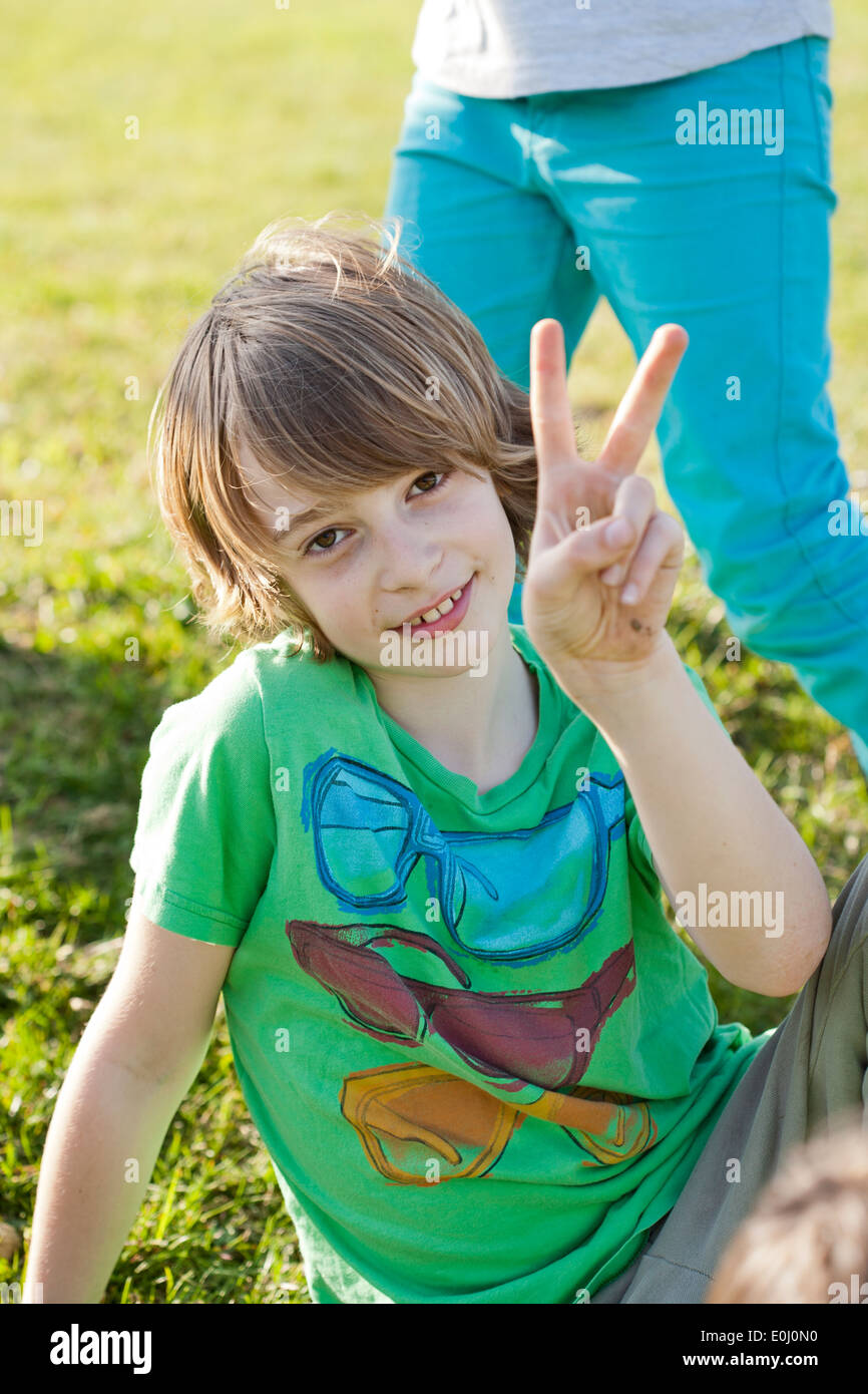Boy playing outdoors. Stock Photo