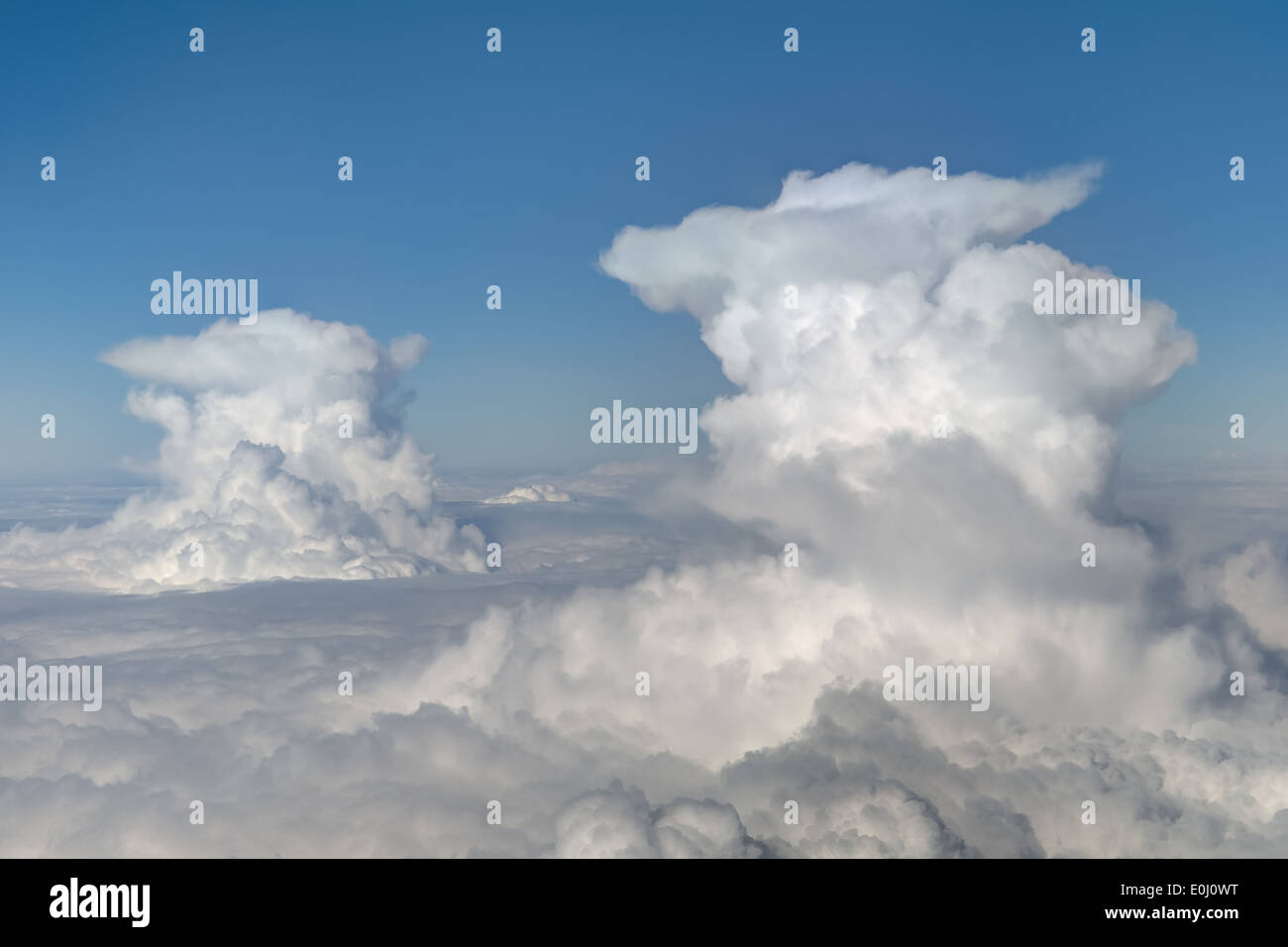 two cumulonimbus clouds on blue sky background Stock Photo