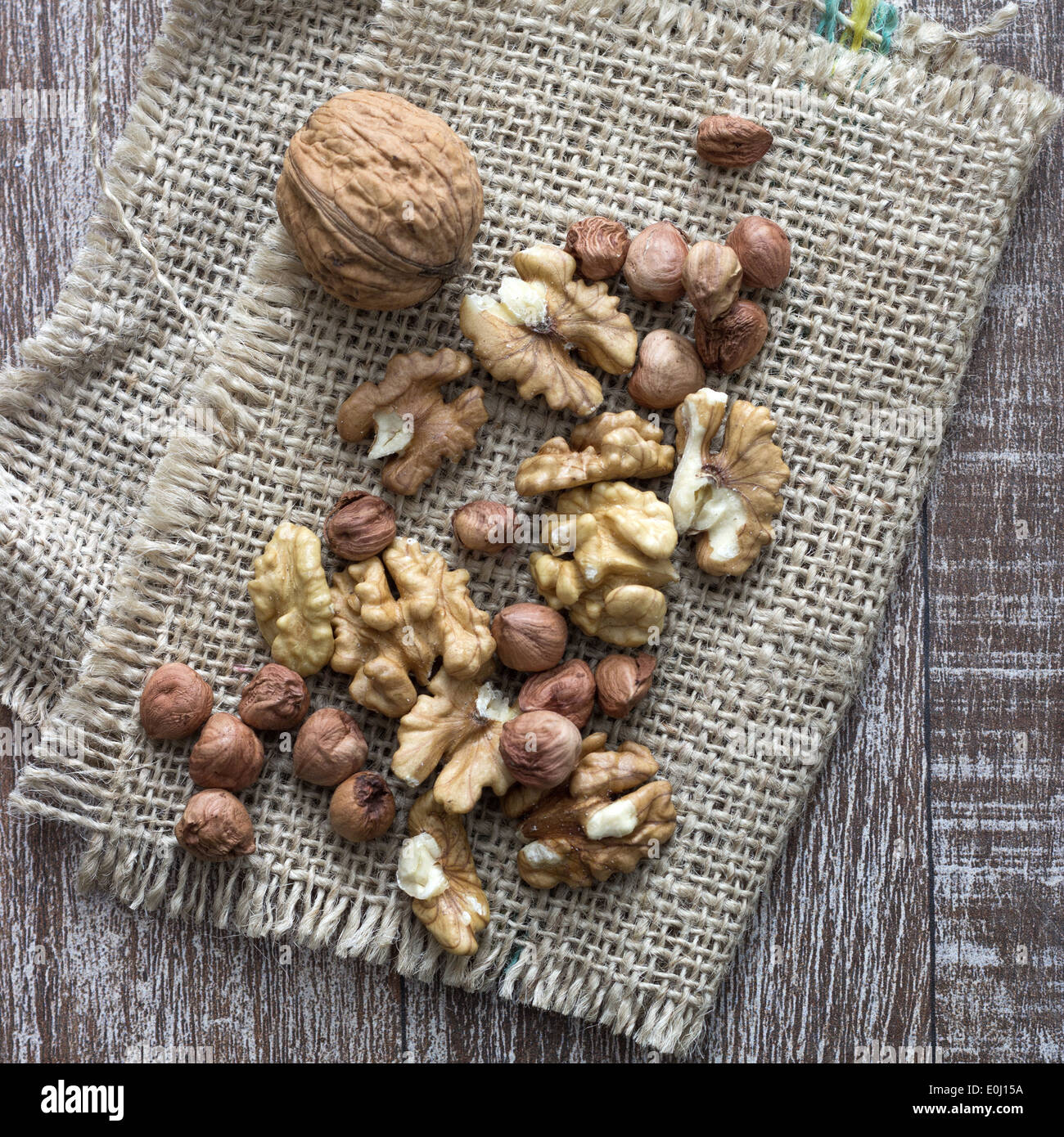 walnuts and hazelnuts on wooden table, close up Stock Photo