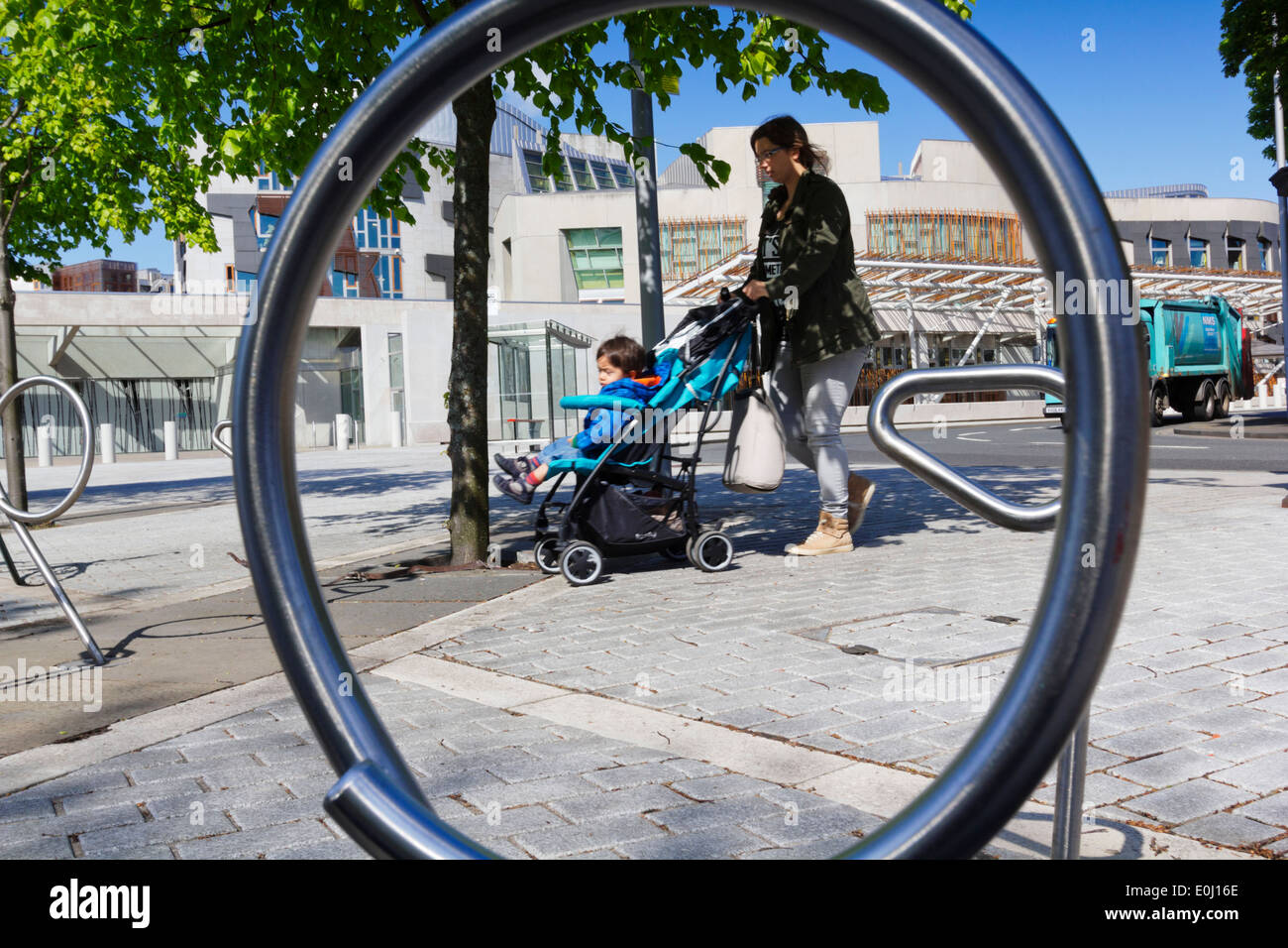 Scottish Parliament Building. Mother With Child In Pram Stock Photo