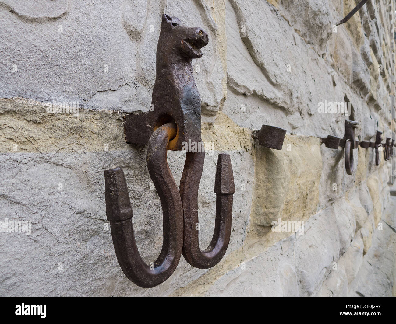 Città di Castello, Umbria, Italy; characteristic wrought iron hooks which were once linked the animal halters Stock Photo
