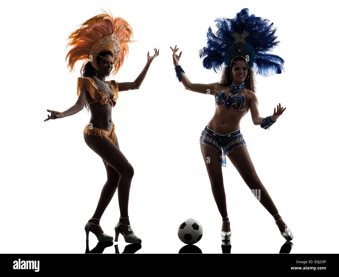 two women samba dancer playing soccer silhouette on white background Stock Photo