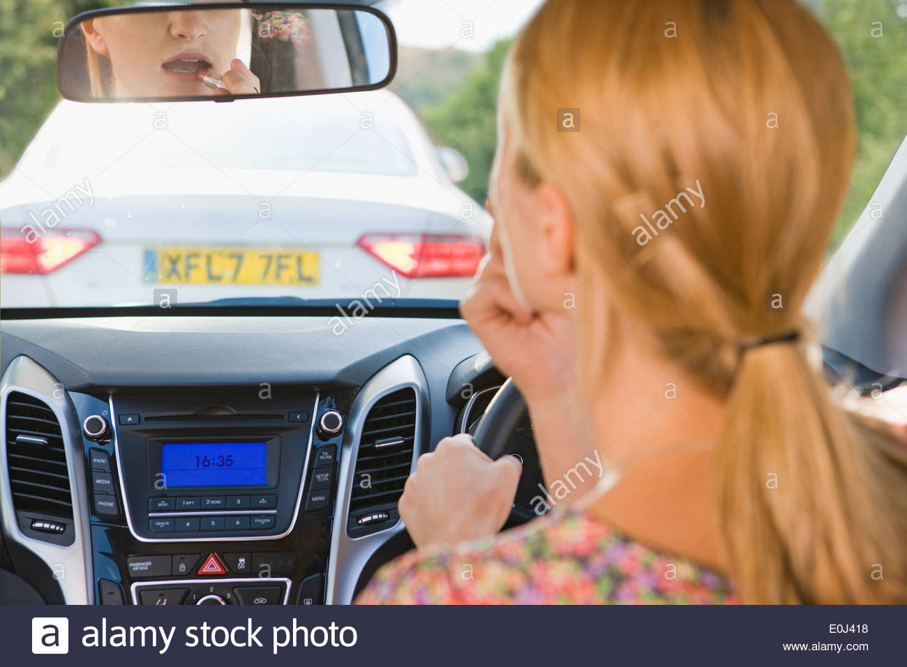 Putting On Lipstick Stock Photos & Putting On Lipstick Stock Images Alamy