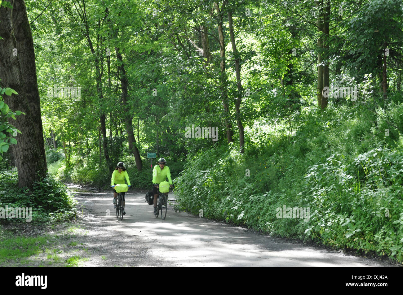 Two Australian cyclists riding their bikes in a natural park along Danube River, between Mauthausen and Grein, Austria Stock Photo