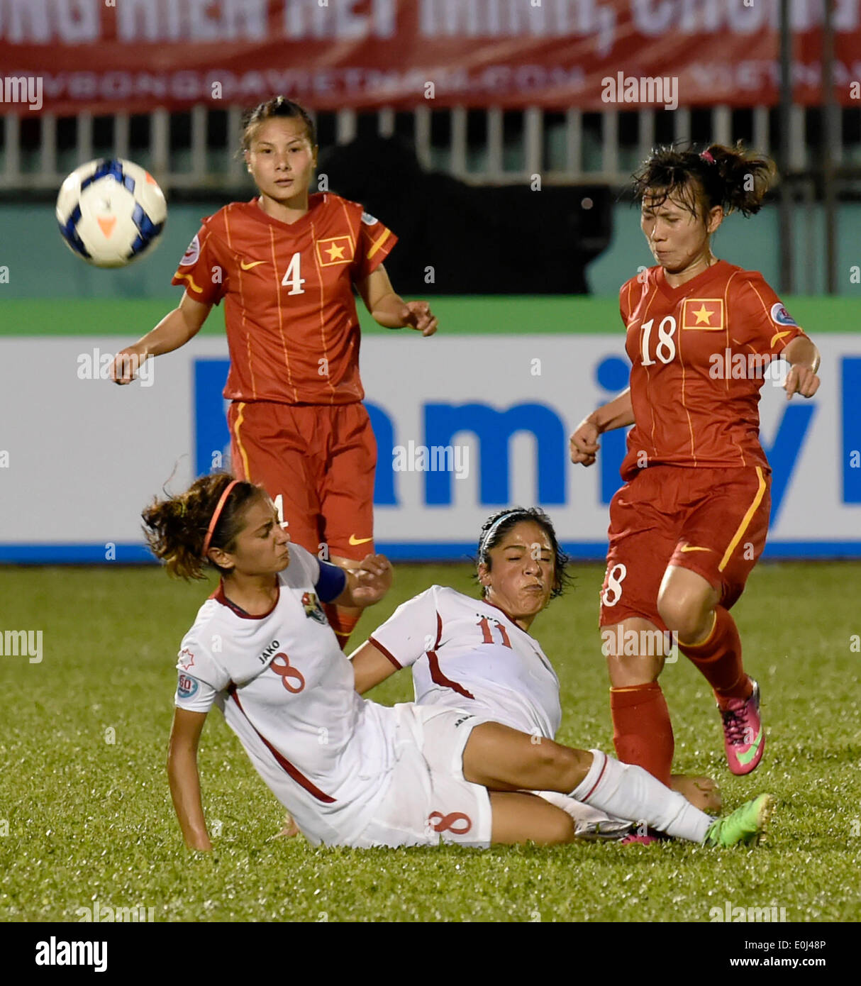 Ho Chi Minh City, Vietnam. 14th May, 2014. Vietnam's Nguyen Thi Lieu (1st R) vies with Jordan's Maysa Ziad Mahmoud Jbarah (2nd R) and Stephanie Mazen Yousef Alnaber (3rd R) during their Group A match at the 2014 AFC Women's Asian Cup held at Thong Nhat Stadium in Ho Chi Minh city, Vietnam, May 14, 2014. Vietnam beat Jordan 3-1. © He Jingjia/Xinhua/Alamy Live News Stock Photo