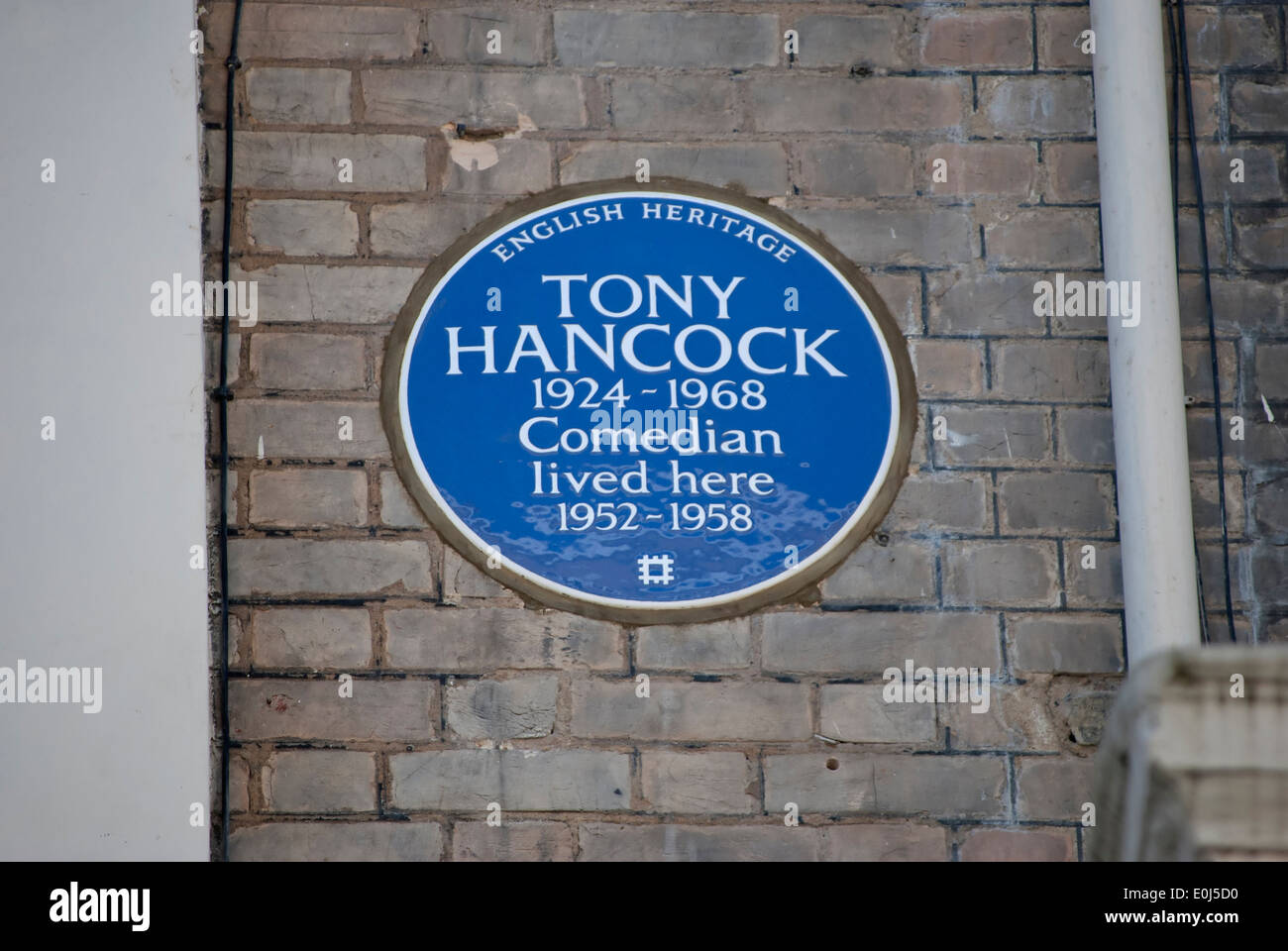 english heritage blue plaque marking a home of comedian tony hancock, kensington, london, england Stock Photo