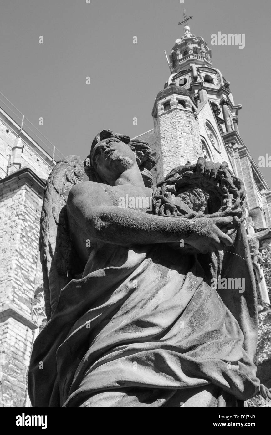 ANTWERP, BELGIUM - SEPTEMBER 5, 2013: Stone statue of angel from calvary beside St. Pauls church (Paulskerk). Stock Photo