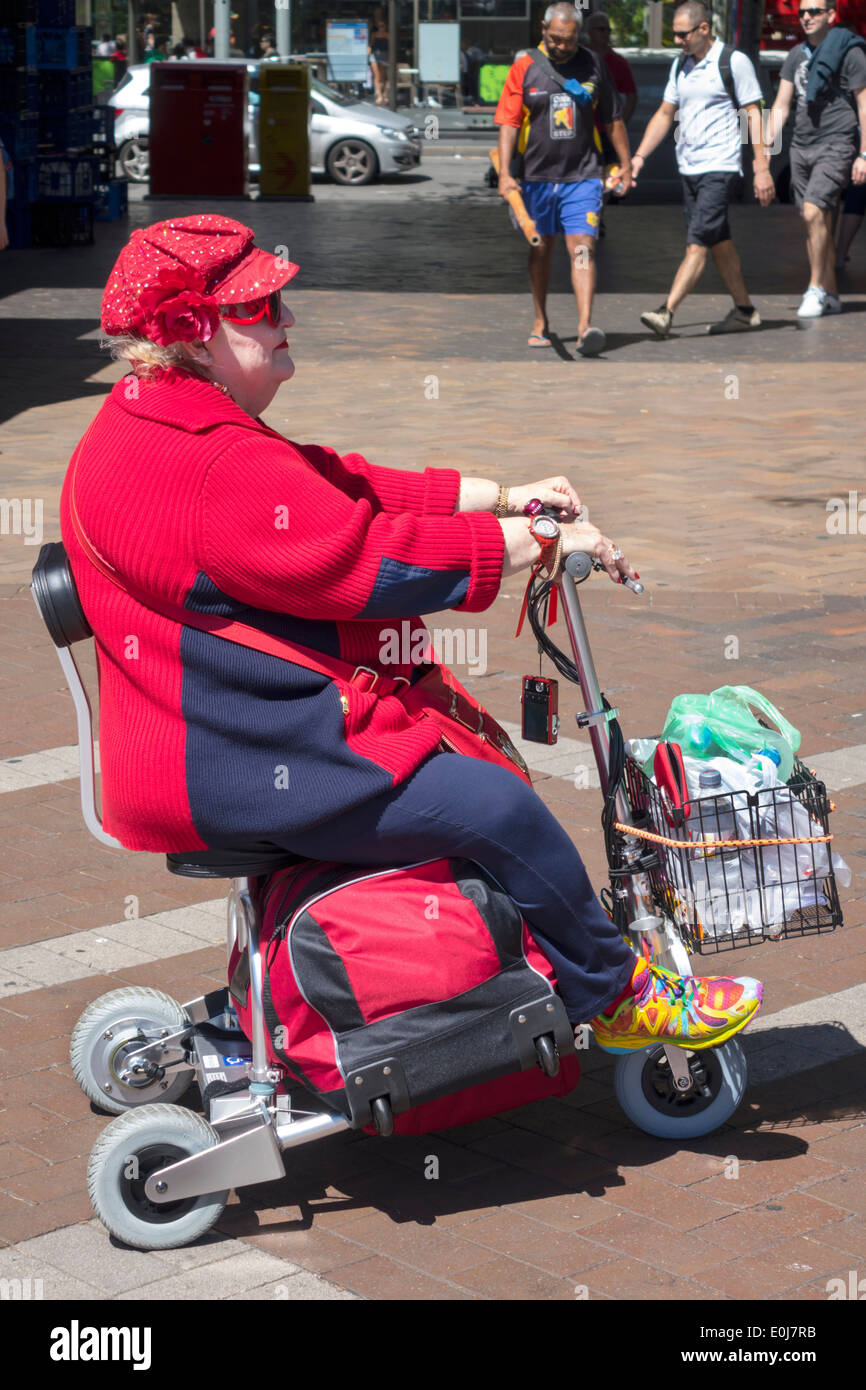 Sydney Australia,Circular Quay,senior seniors citizen citizens,pensioner,pensioners,retired,woman female women,disabled,well dressed,hat,cap,electric, Stock Photo