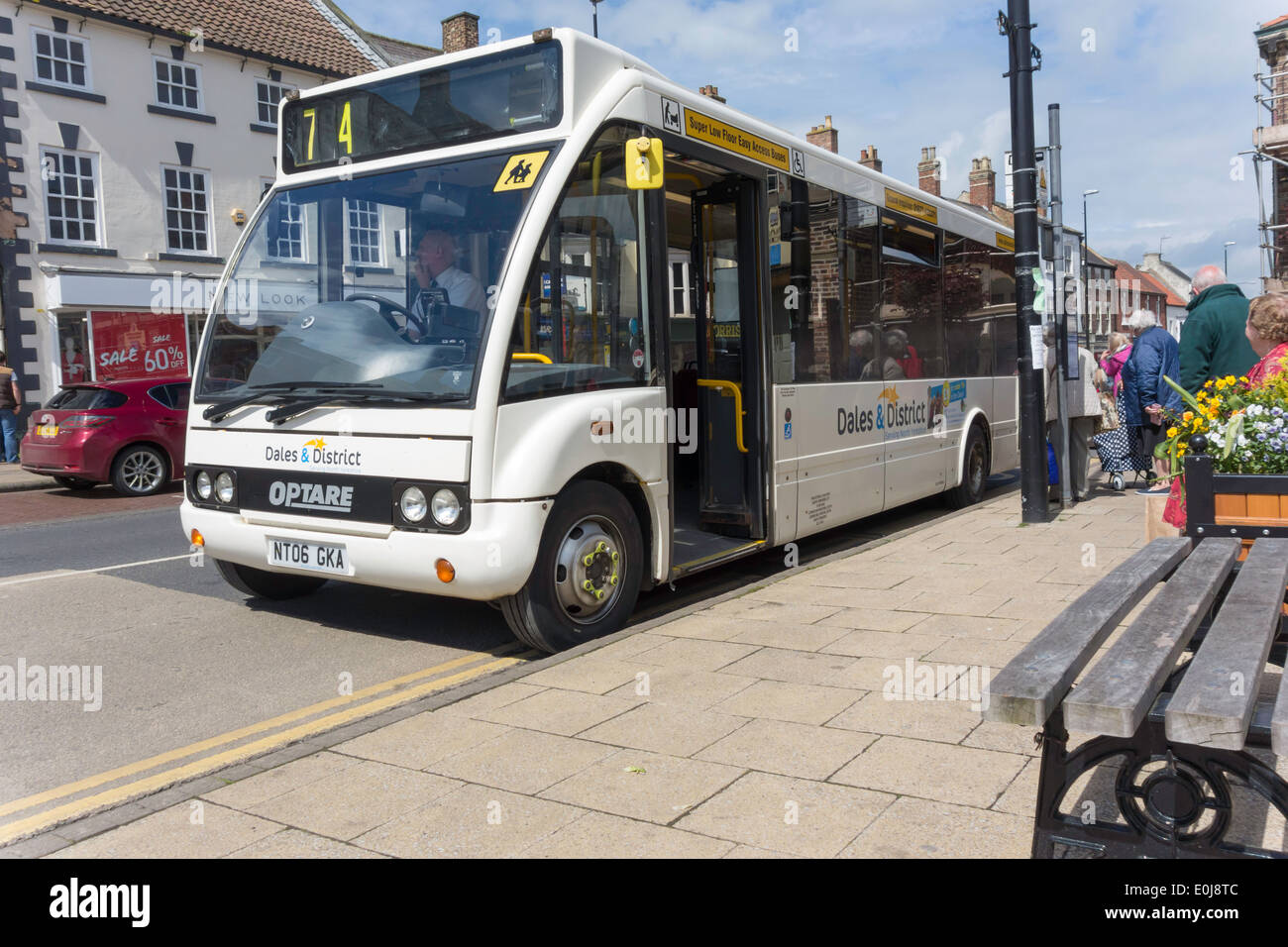 A modern white Dales & District single decker bus with low floor to facilitate entry in Northallerton 2014 Stock Photo