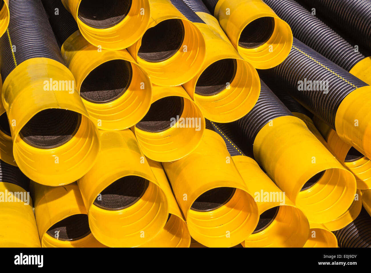 Drainage pipes stacked plastic black yellow stacked together for