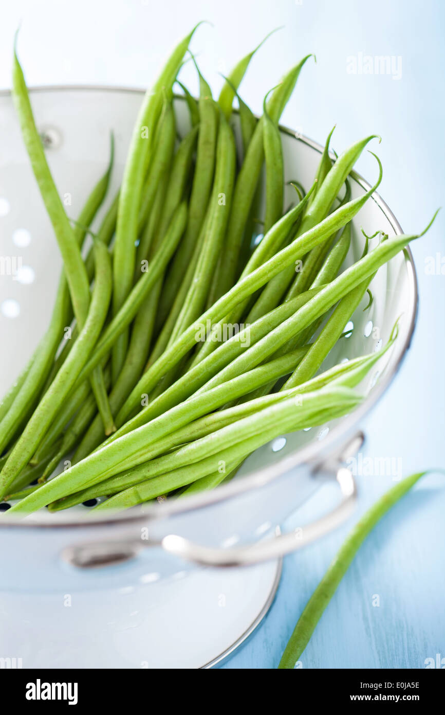 Raw green beans in colander hi-res stock photography and images - Alamy