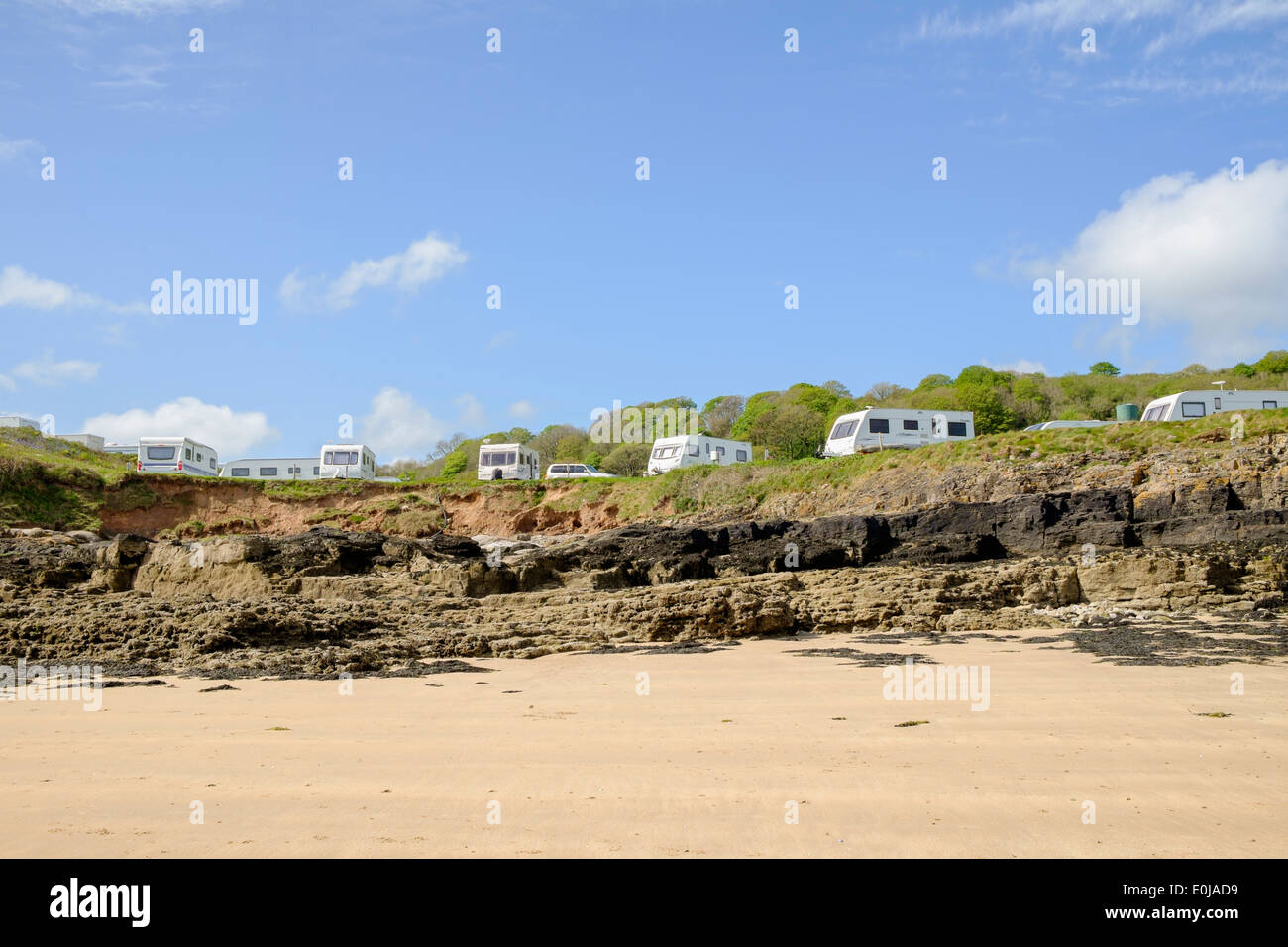 Caravan site overlooking a beach on the coast in Red Wharf Bay, Isle of Anglesey, North Wales, UK, Britain Stock Photo