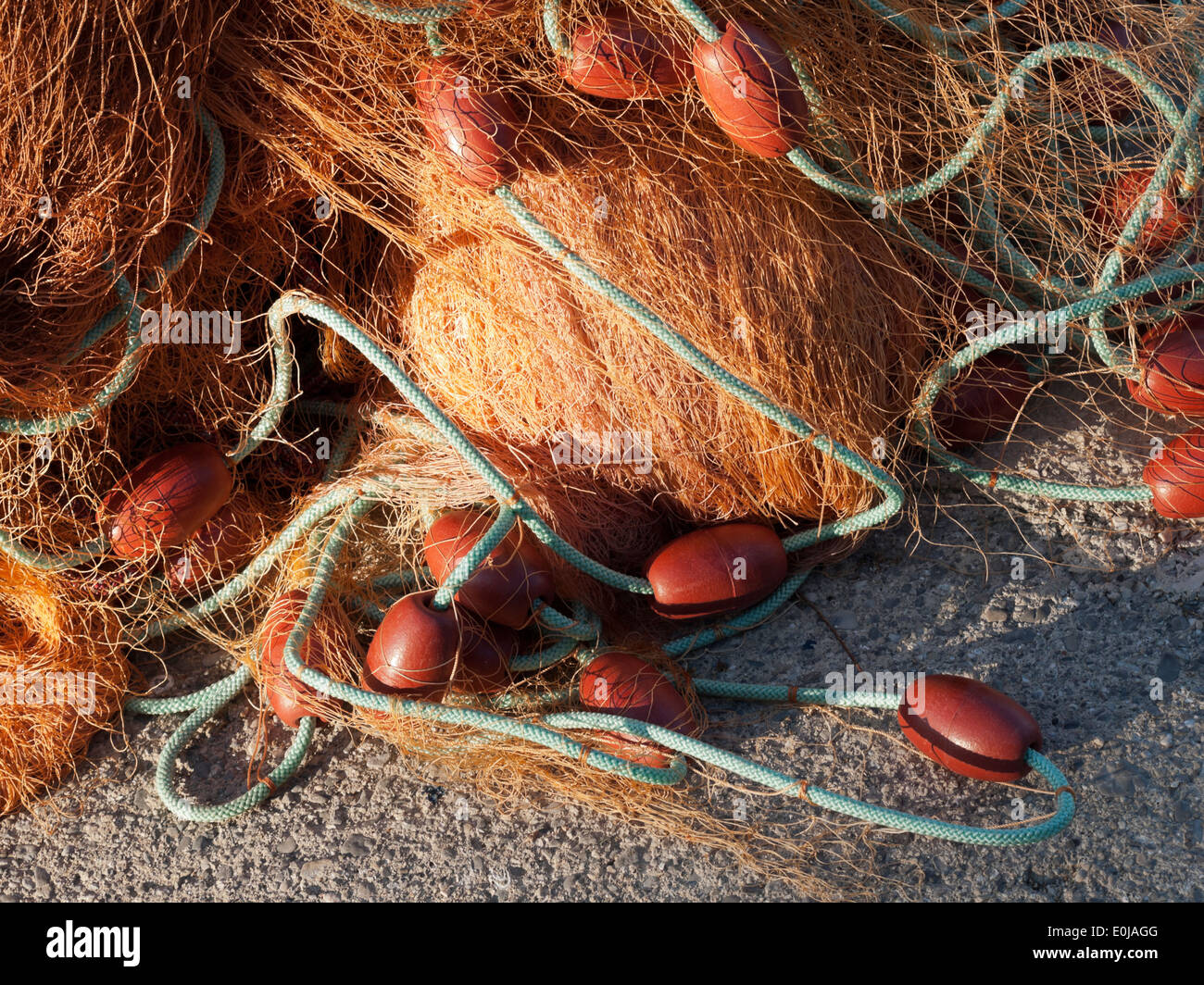 old fishing net with buoys in the port Stock Photo
