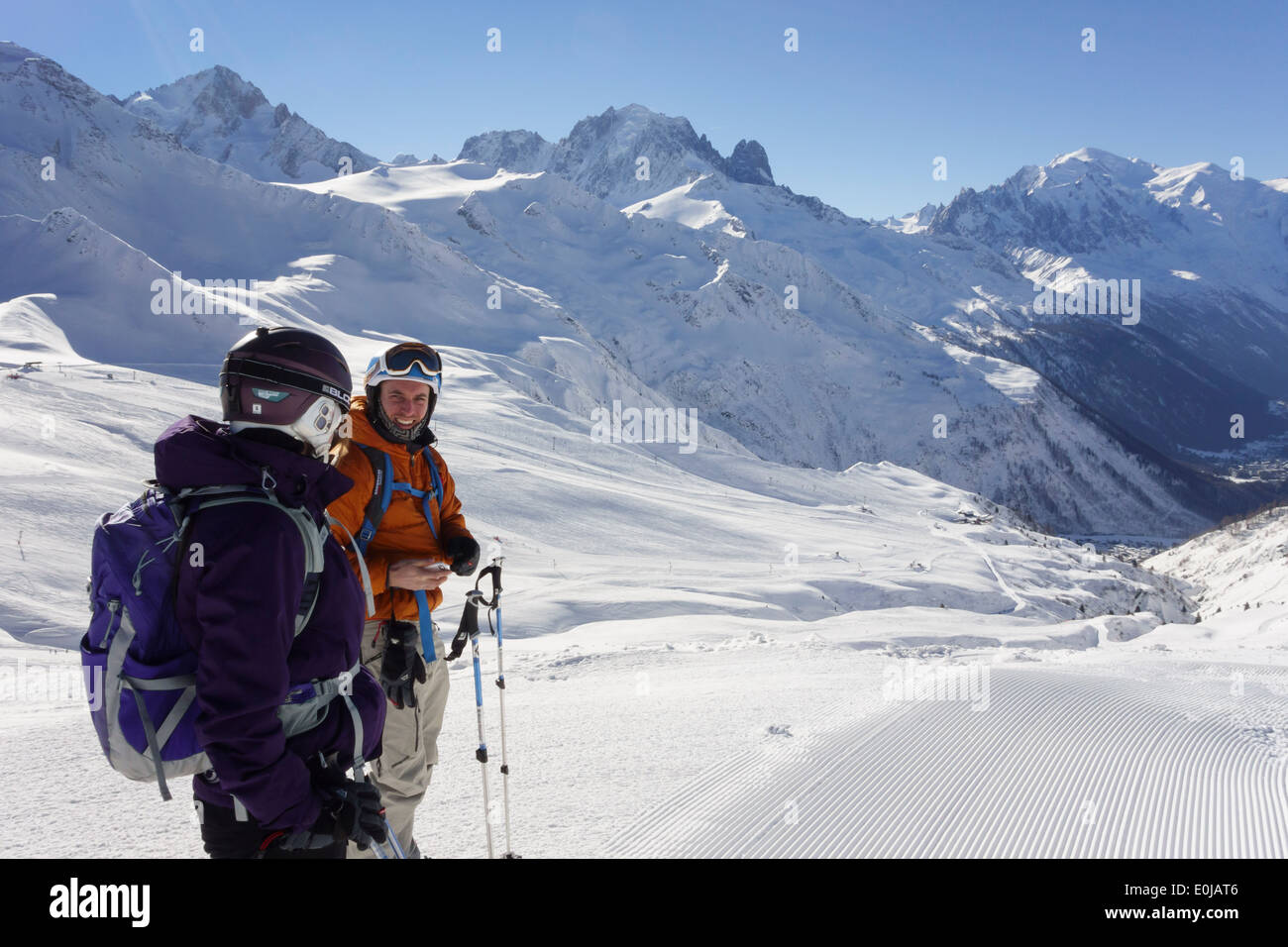 Two skiers on snow slopes in the French Alps at resort of Le Tour, Chamonix-Mont-Blanc, Haute Savoie, Rhone-Alpes, France, Europe. Stock Photo
