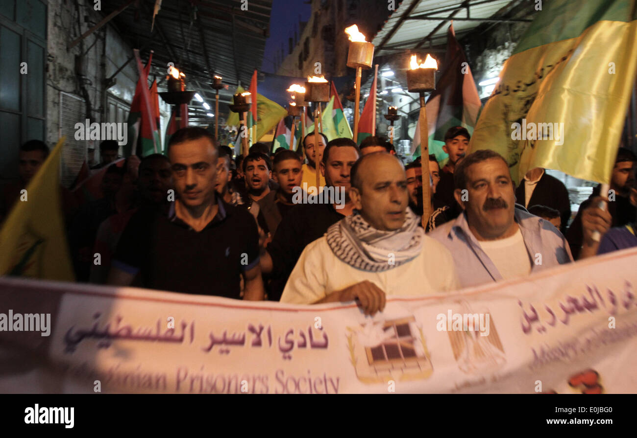 Nablus, West Bank, Palestinian Territory. 14th May, 2014. Palestinians attend a torch-bearing march in a commemoration on the eve of the 66th anniversary of the ''Nakba'' in the West Bank City of Nablus on May 14, 2014. ''Nakba'' means in Arabic ''catastrophe'' in reference to the birth of the state of Israel 66-years-ago in British-mandate Palestine, which led to the displacement of hundreds of thousands of Palestinians who either fled or were driven out of their homes during the 1948 war over Israel's creation Credit:  Nedal Eshtayah/APA Images/ZUMAPRESS.com/Alamy Live News Stock Photo