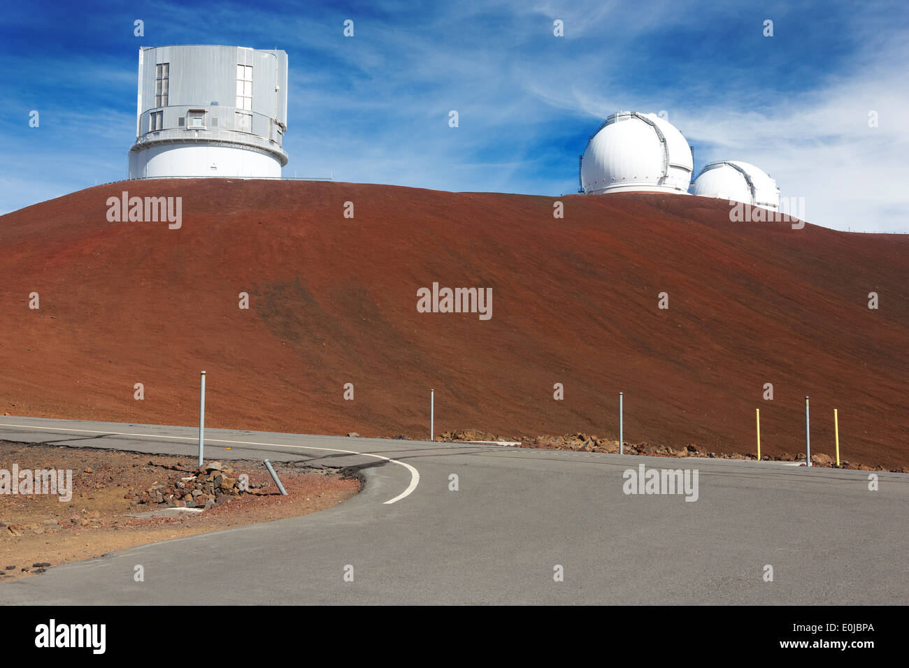 Astronomy telescope observatory atop volcanic landscape on Mauna Kea on