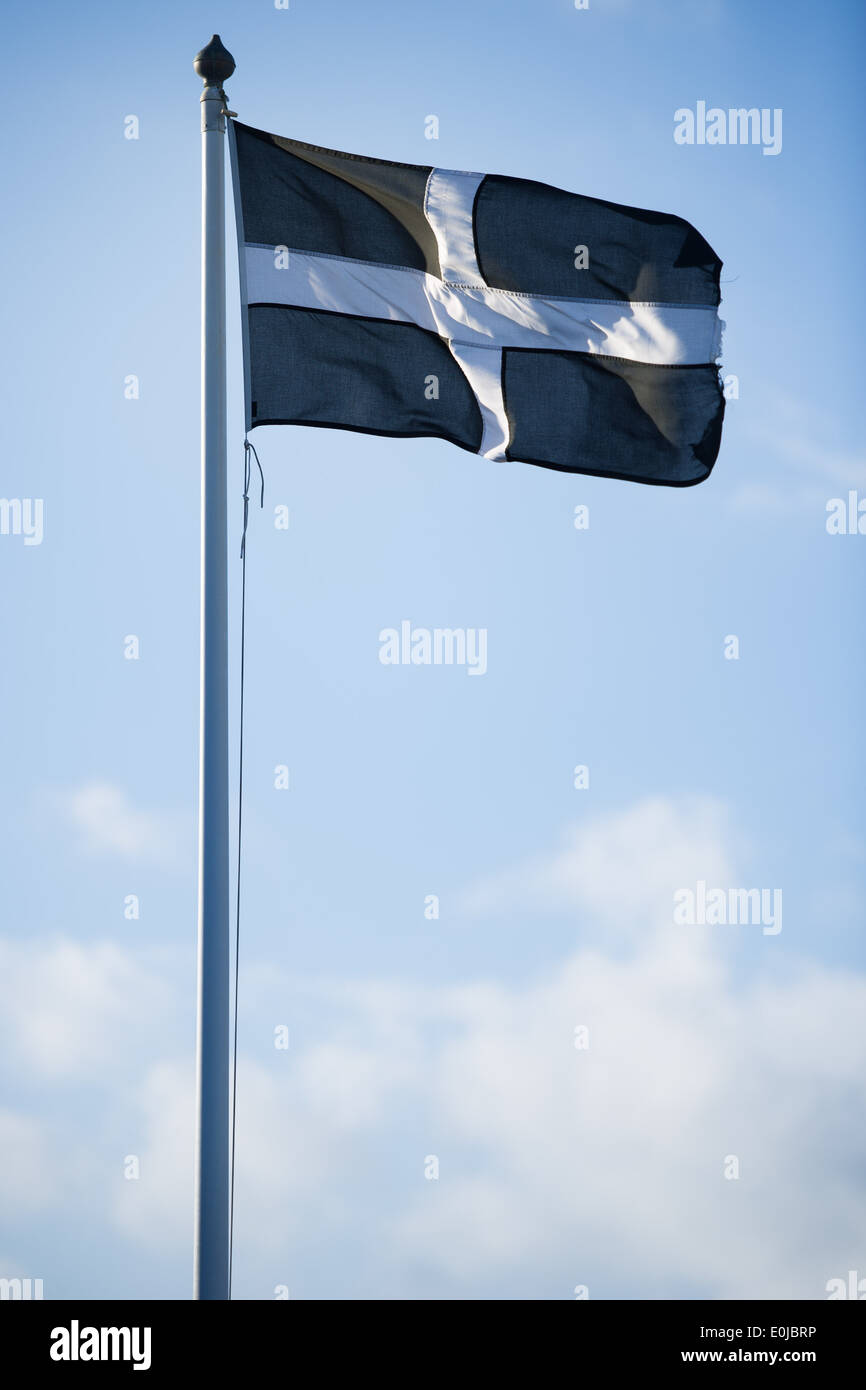 Saint Piran's Flag, the flag of Cornwall, flying at Land's End, England Stock Photo