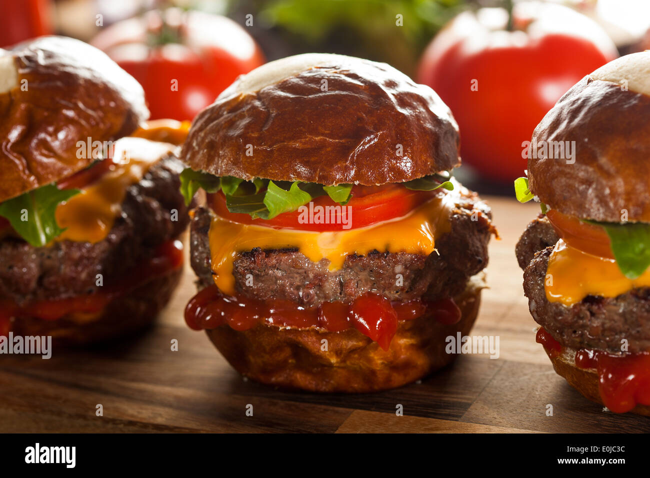 Homemade Cheeseburger Sliders with Lettuce Tomato and Cheese Stock Photo