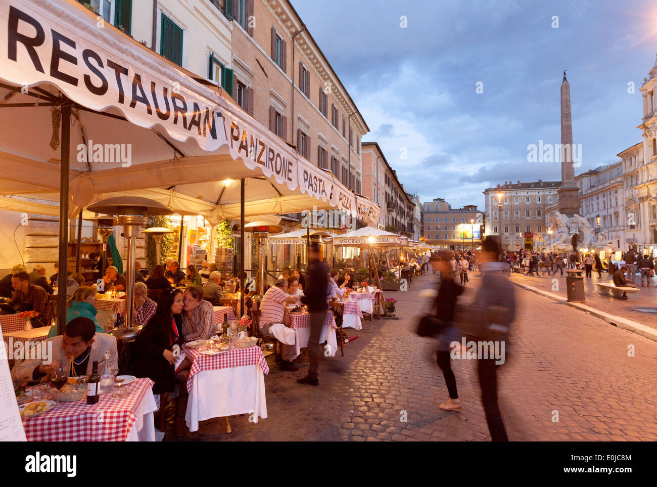 People eating at a restaurant in the early evening, Piazza Navona, Rome, Italy Europe Stock Photo
