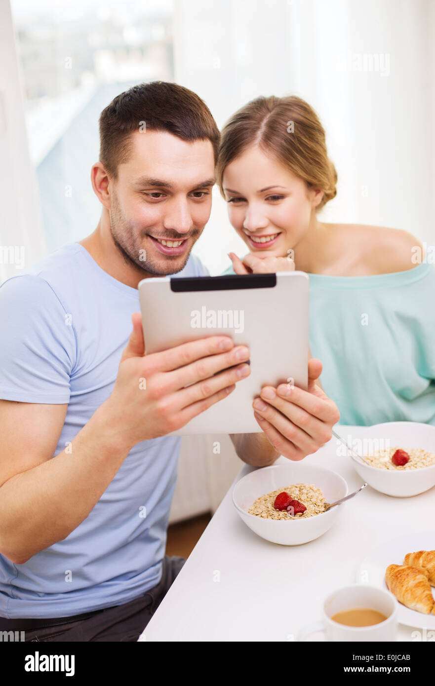 smiling couple with taking picture with tablet pc Stock Photo