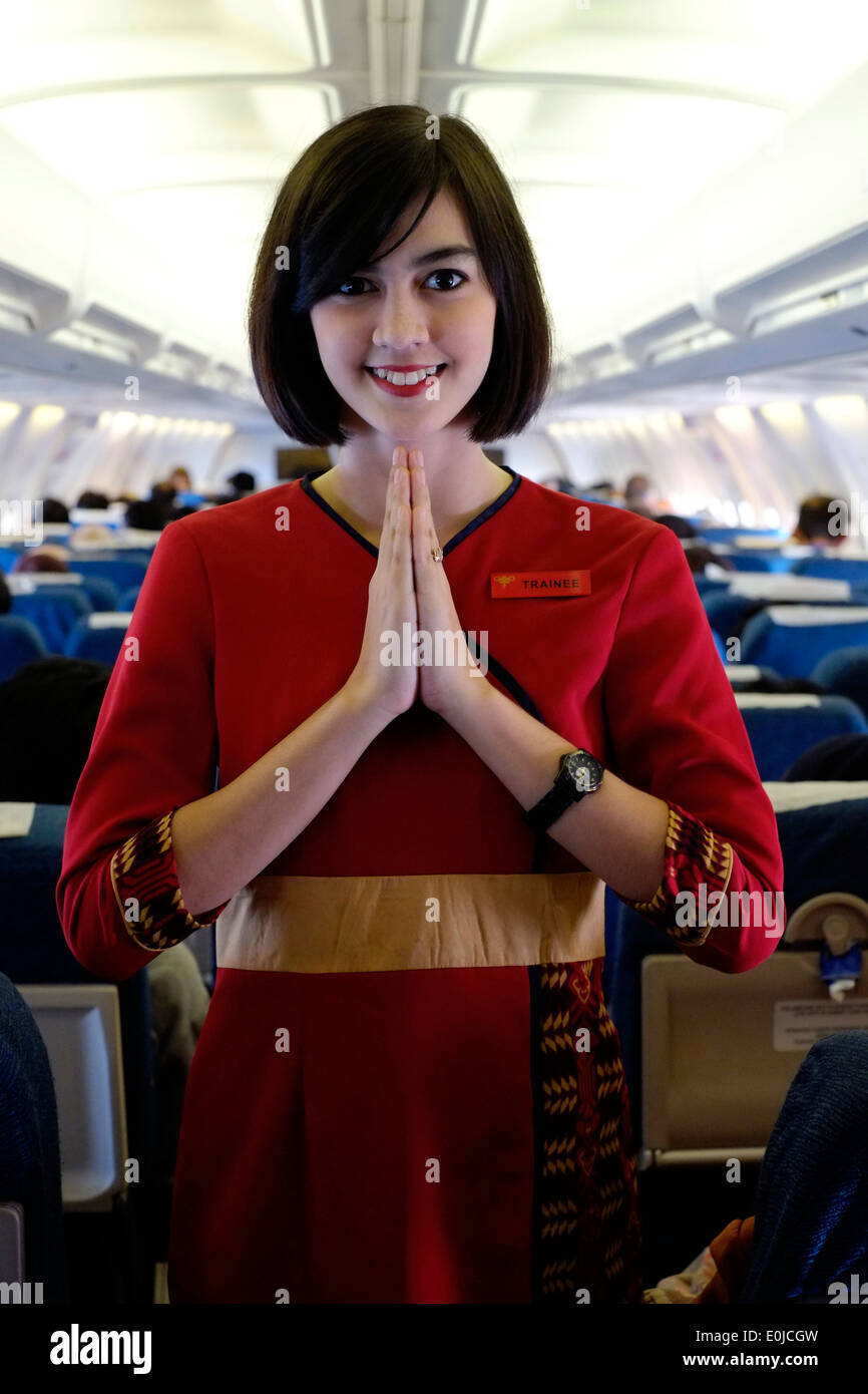 air hostess at work on board a sriwijaya air domestic flight en route from malang to jakarta java indonesia Stock Photo - Alamy air hostess at work on board a sriwijaya air domestic flight en route from malang to jakarta java indonesia Stock Photo - Alamy