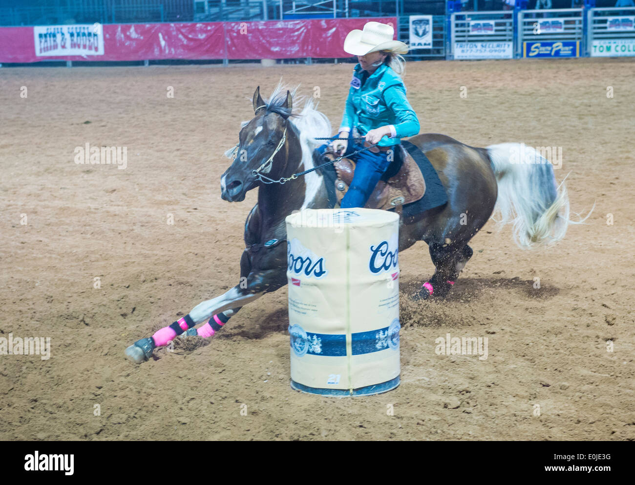 Cowgirl Participating in a Barrel racing competition in the Clark County Rodeo a Professional Rodeo held in Logandale Nevada Stock Photo