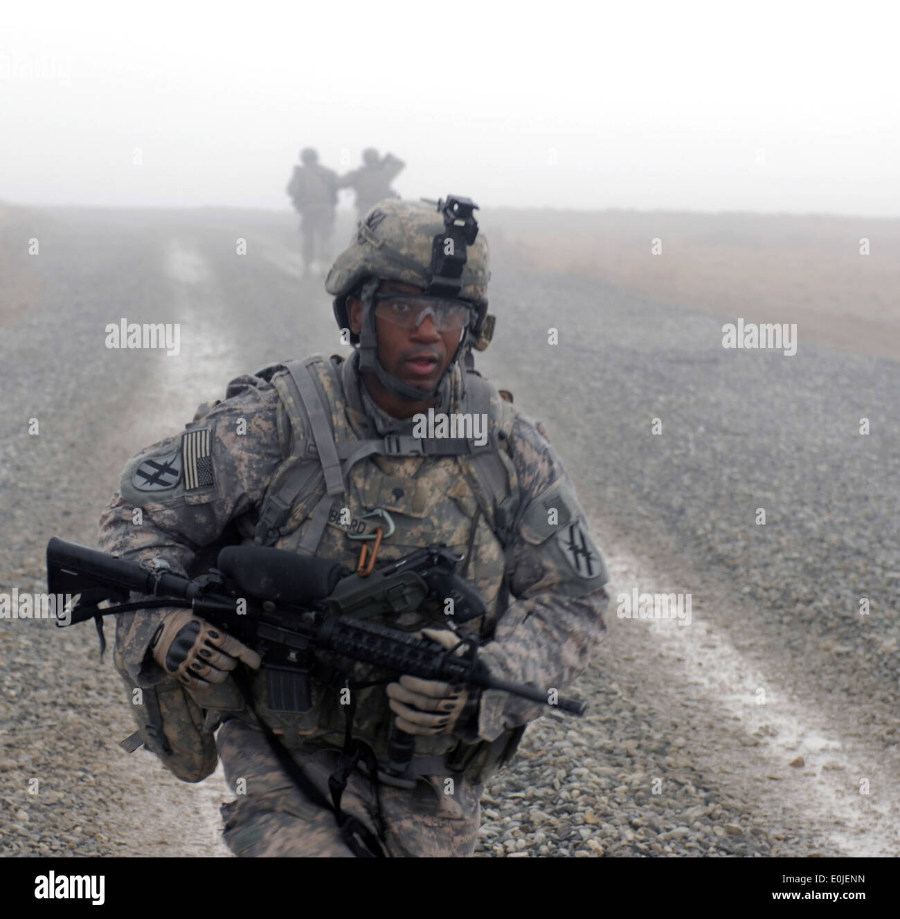 U.S. Army Spc. Darrell Hubbard, 1-121, 48th Infantry Brigade Combat Team, Georgia Army National Guard, completes a nine-mile ru Stock Photo